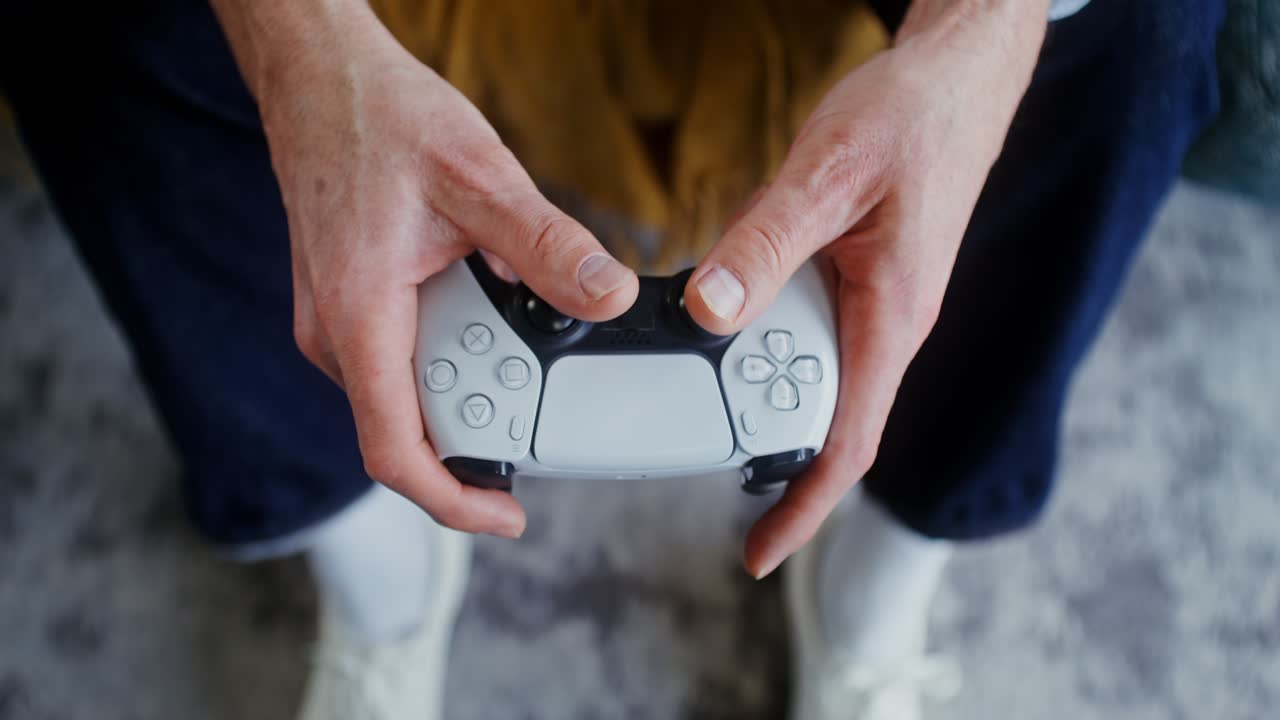 Hands holding a Playstation controller