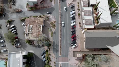 sedona, arizona downtown traffic with drone video overhead looking down then tilting up