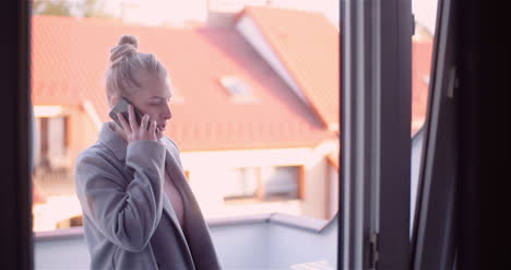 Woman-Talking-On-Mobile-Phone-With-Friend-During-Pandemic-Covid-19-Coronavirus-1