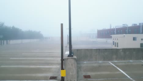 Aerial-View-of-Empty-Parking-Lot-Shrouded-By-Thick-Fog-In-The-Early-Morning-In-Northampton,-Massachusetts,-USA