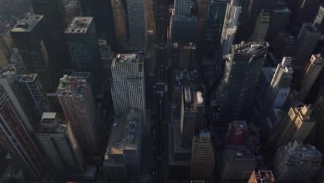 High-angle-view-of-streets-and-crossroads-between-high-rise-buildings-in-city.-Manhattan,-New-York-City,-USA