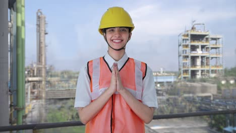 happy indian female architect doing namaste