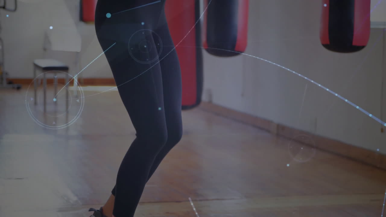 woman performing jump rope in fitness studio, with animated heart icon and data chart overlay