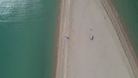 4k overhead clip over a peninsula on the tropical beach of epanomi, halkidiki, greece