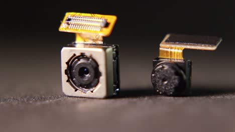 macro close-up of smartphone back and front camera lenses