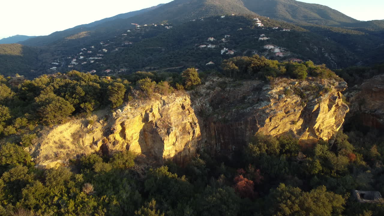 Mountainous Landscape with Village and Cliff