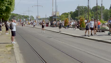athletic people running at annual adidas stockholm marathon event in sweden. slow motion