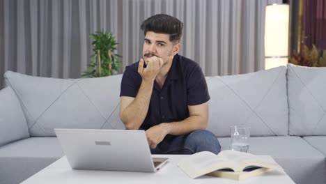 Worried-young-man-looks-at-camera.