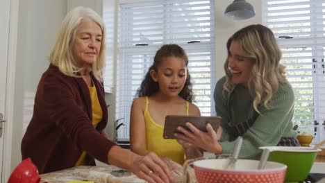 video of happy diverse family cooking together in the kitchen