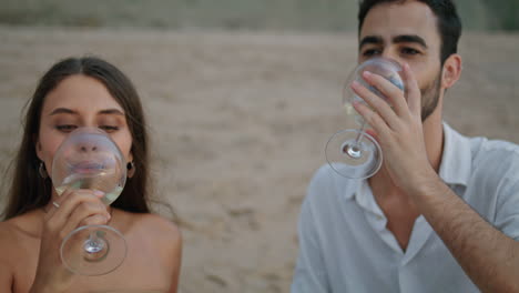 laughing lovers toasting glasses picnic outdoors closeup. love couple clinking