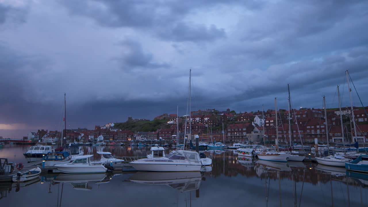 Whitby Harbour Motion Timelapse footage from the marina looking towards the Abbey headland. Ominous moody storm clouds. North York Yorkshire Moors