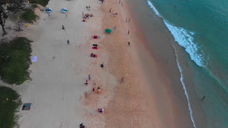 Fly-over-tilt-down-aerial-drone-shot-of-Karon-beach,-a-public-area-in-the-island-of-Phuket-facing-the-Andaman-Sea-in-the-southern-part-of-Thailand