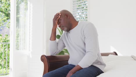 Tired-african-american-senior-man-having-headache