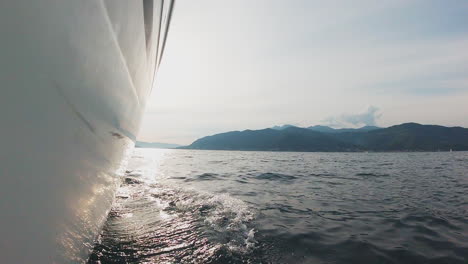 luxury yacht sailing along the coastline