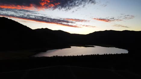 Aerial-shot-of-a-sunset-on-a-lake-in-Chile