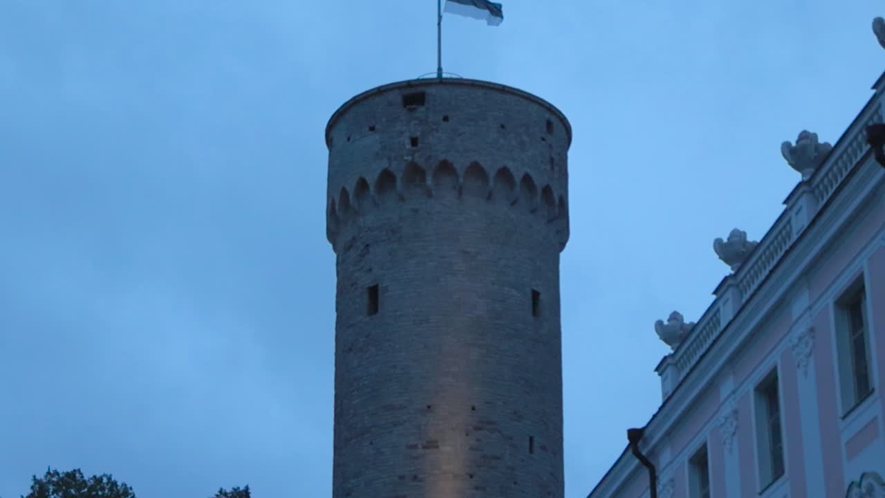 Slow motion footage of Hermann tower and a flag on top of it waving during late summer or autumn night or early morning meaning dusk