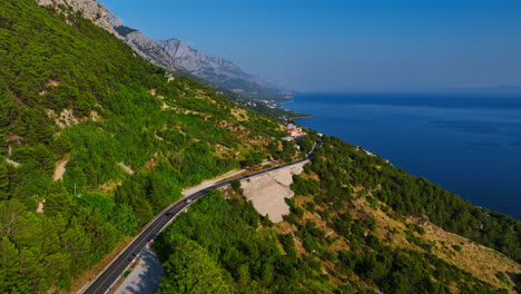 Aerial-view-following-traffic-on-the-coast-of-the-Makarska-riviera-in-Croatia