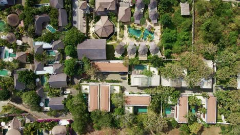 aerial view of bali real estate development luxury villas, resorts with swimming pool located in bingin, badung, bukit