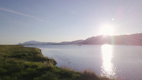 aerial footage of a wild lake during sunny summer in snaefellsness peninsula, iceland