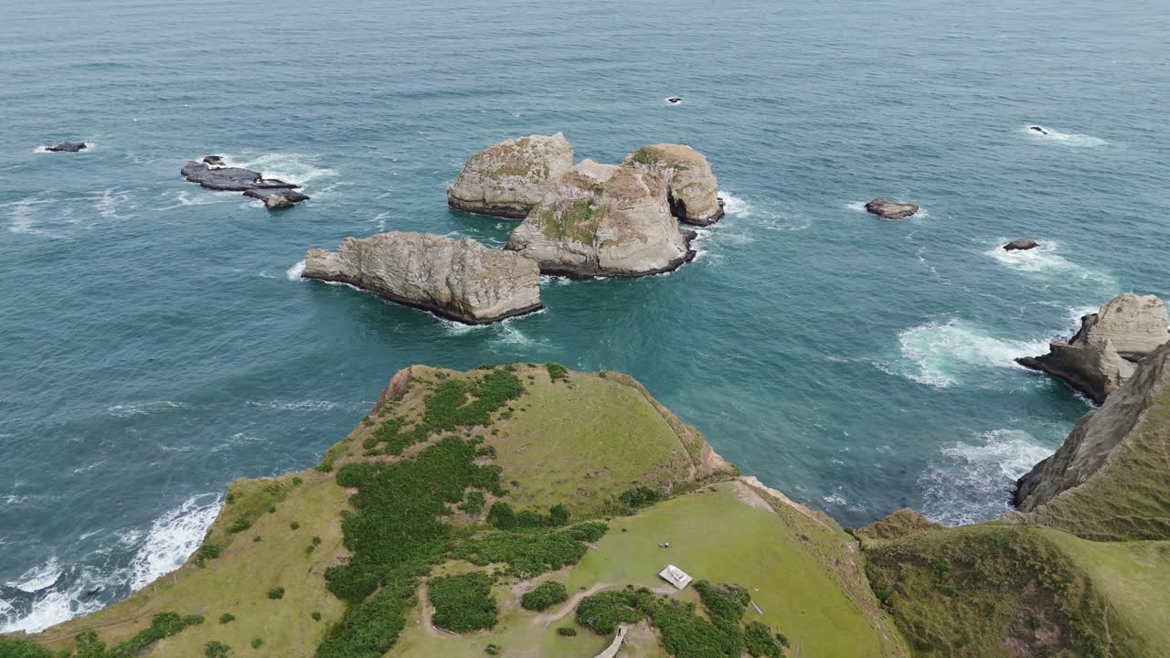 Stunning aerial perspective capturing the dramatic beauty of Muelle De Las Almas and the rugged coastline near Chonchi, Chile, a captivating travel destination