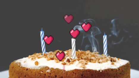 animation of hearts floating over birthday cake