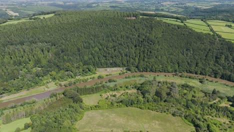 drone aerial reveal of rolling cornish countryside featuring the river tamar winding through the landscape, cornwall, uk