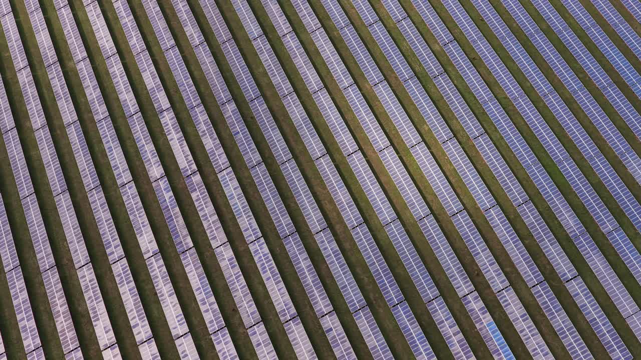 Renewable energy from solar panels from an aerial view. Field of collectors on a sunny day