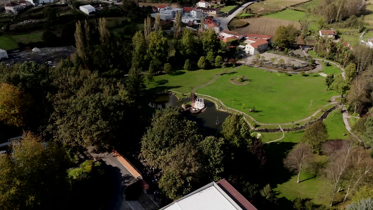 Aerial view of a park in Paços de Ferreira Portugal surrounded by trees, fields, and buildings