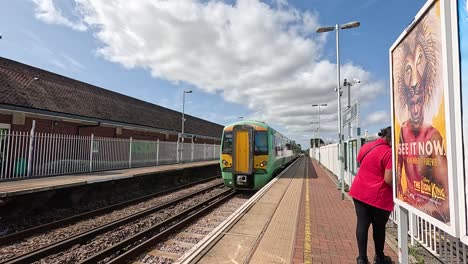 train arrives at platform with passengers onboard