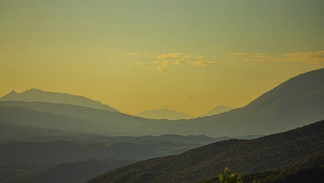 abstract misty mountain ranges with flowing cloudscape, time lapse view