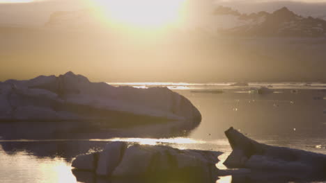 glaciers floating at jokulsarlon lagoon during sunrise, iceland