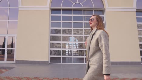 woman walking near a building