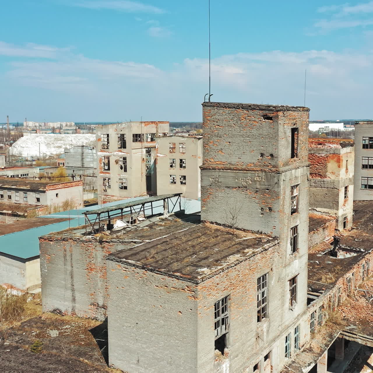 Flight over the destroyed factory. Old industrial building for demolition. Aerial view
