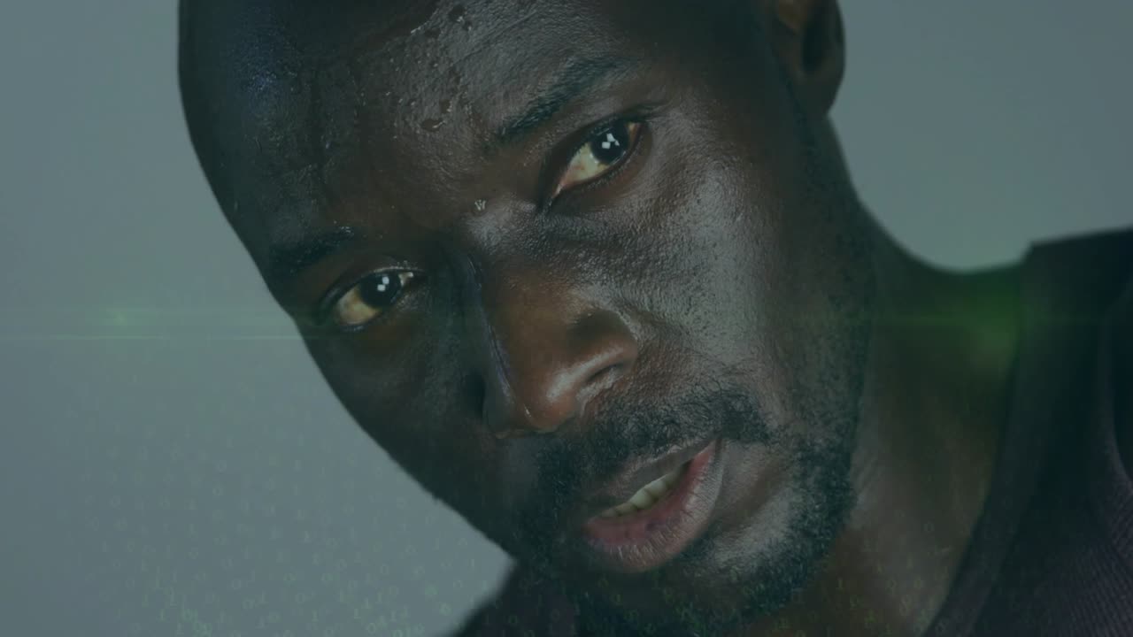 Mature man raising hand as projection intensifying, reading tech grid across face with green flare