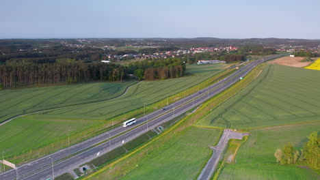 aerial view of highway road cutting through picturesque landscape of poland