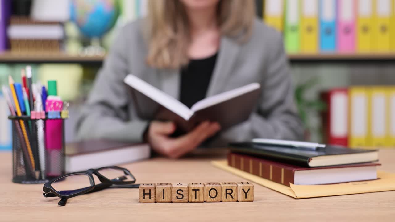Image of history books and office supplies