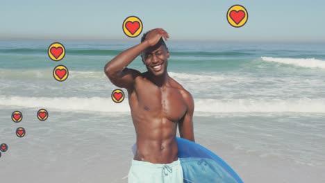 animación de iconos digitales de corazón sobre un hombre sosteniendo una tabla de surf en la playa