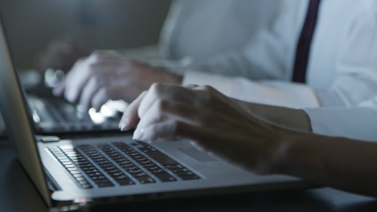 Cropped shot of people typing on laptops
