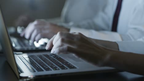 Cropped-shot-of-people-typing-on-laptops