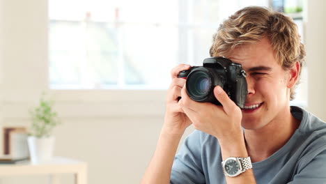 happy man taking photograph