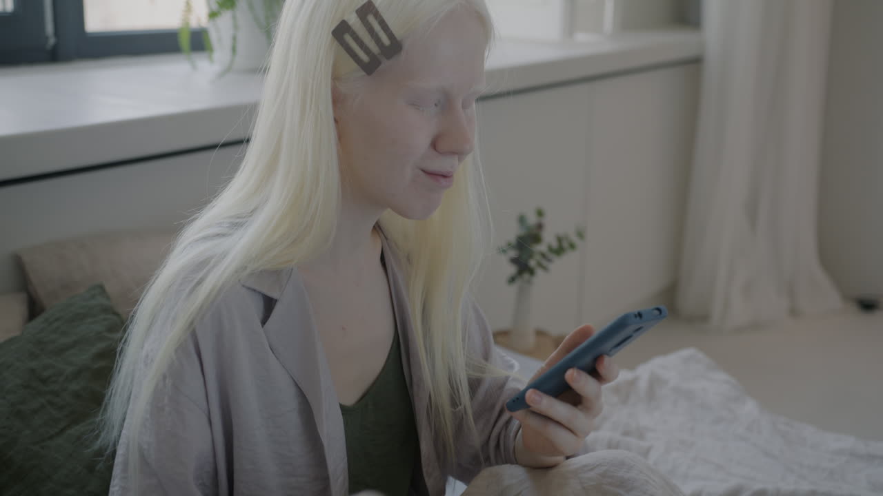 Young Woman Paying Online from Bed
