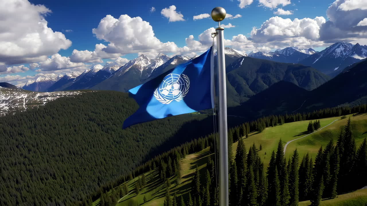 United Nations Flag Waving Over Alpine Mountains