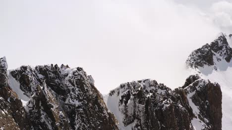 Incredible-breathtaking-aerial-view-over-Cima-d'Asta-peak-of-Dolomite-mountains-in-winter