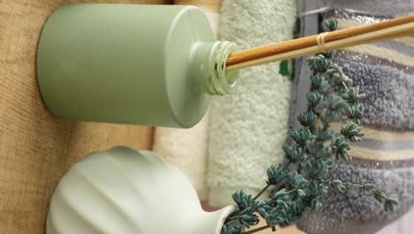 aromatherapy and spa essentials: reed diffuser with lavender and towels