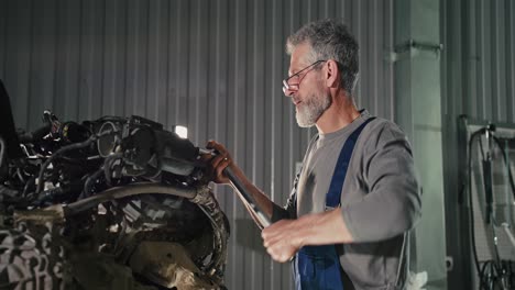 automotive mechanic working on a car engine