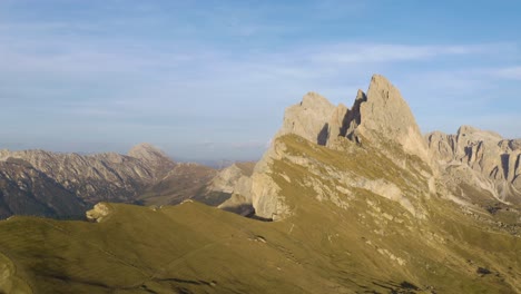 cinematic drone shot above seceda mountain ridgeline on clear day