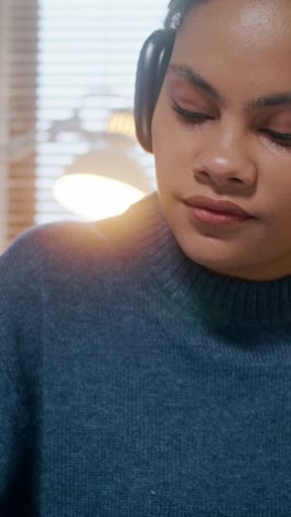 woman listening to music at home