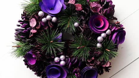 christmas wreath on white wooden background