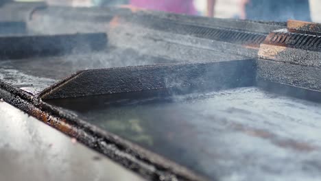 outdoor food stall cooking on a hot plate