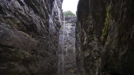 biggest glacier canyon with raging fast flowing river and high waterfall